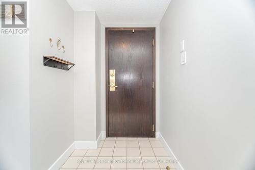 Inside Entry With Ceramic Tile Flooring - 1003 - 100 Millside Drive, Milton (Om Old Milton), ON - Indoor Photo Showing Other Room