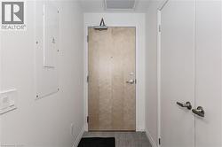Doorway with electric panel and baseboards - 