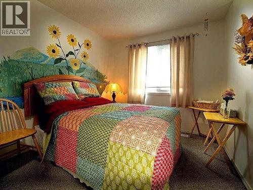 148 & 150 Dawson Drive, Faro, YT - Indoor Photo Showing Bedroom