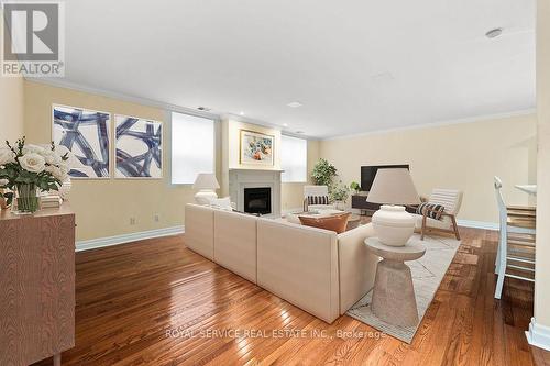 Virtually staged - 1 - 220 Church Street, Cobourg, ON - Indoor Photo Showing Living Room With Fireplace
