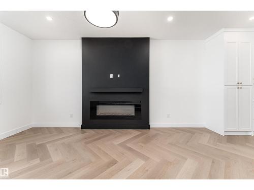 3127 Magpie Wy Nw, Edmonton, AB - Indoor Photo Showing Living Room With Fireplace
