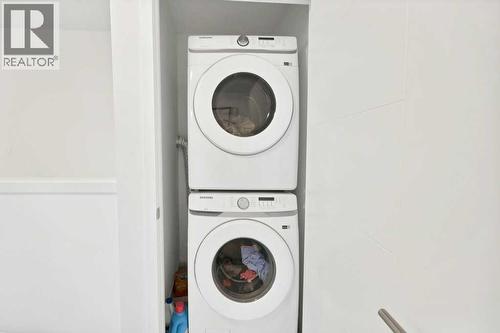 117 South Point  Sw, Airdrie, AB - Indoor Photo Showing Laundry Room