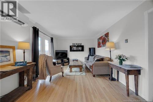 34 Old Road, Nauwigewauk, NB - Indoor Photo Showing Living Room With Fireplace