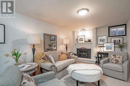 5 - 1580 Kerns Road, Burlington, ON - Indoor Photo Showing Living Room With Fireplace