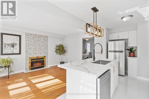 63 - 5230 Glen Erin Drive, Mississauga, ON - Indoor Photo Showing Kitchen With Fireplace With Upgraded Kitchen