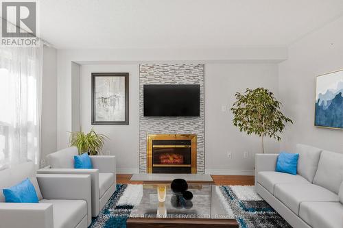 63 - 5230 Glen Erin Drive, Mississauga, ON - Indoor Photo Showing Living Room With Fireplace