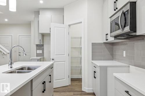 309 26 St Sw, Edmonton, AB - Indoor Photo Showing Kitchen With Double Sink