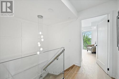 Showpiece Staircase Enhanced with Glass Panels - 108 - 2489 Taunton Road, Oakville, ON - Indoor Photo Showing Other Room