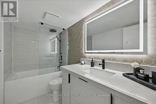 Spa-Inspired Bath Features a Statement Mirror - 108 - 2489 Taunton Road, Oakville, ON - Indoor Photo Showing Bathroom