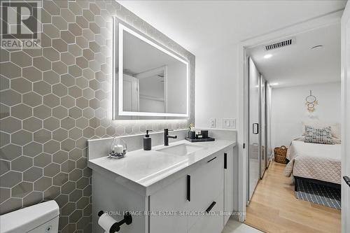 Spa-Inspired Bath Features an Upgraded Backsplash - 108 - 2489 Taunton Road, Oakville, ON - Indoor Photo Showing Bathroom