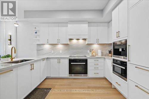 Beautifully Balanced Design Merges Form & Function - 108 - 2489 Taunton Road, Oakville, ON - Indoor Photo Showing Kitchen With Upgraded Kitchen