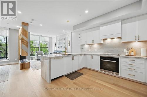 Blending Inspired Design with Everyday Comfort - 108 - 2489 Taunton Road, Oakville, ON - Indoor Photo Showing Kitchen With Upgraded Kitchen