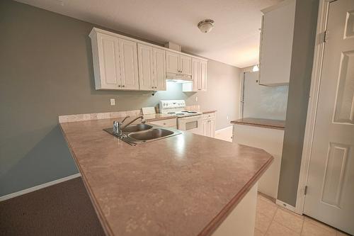 4866 Emerald Avenue, Canal Flats, BC - Indoor Photo Showing Kitchen With Double Sink