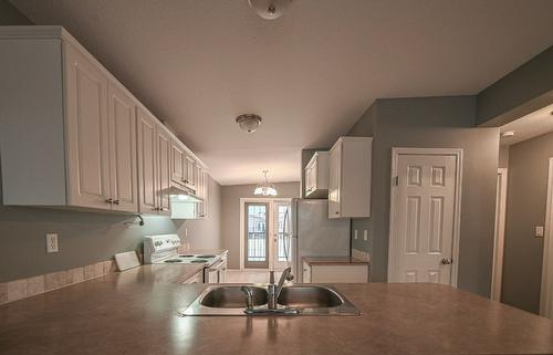 4866 Emerald Avenue, Canal Flats, BC - Indoor Photo Showing Kitchen With Double Sink