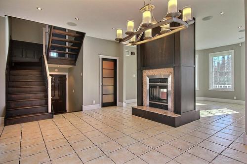 Dining room - 10 Rue De La Pointe-Aux-Bleuets, Fossambault-Sur-Le-Lac, QC - Indoor Photo Showing Other Room With Fireplace