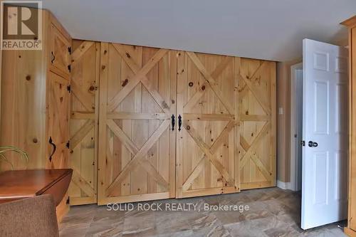 Barn doors between 2nd bdrm & primary bdrm - 5 Shoreline Road, Edwardsburgh/Cardinal, ON - Indoor Photo Showing Other Room