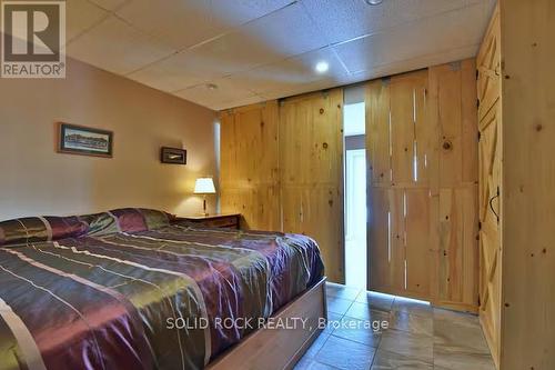 Barn doors separating mstr bdrm from 2nd bdrm - 5 Shoreline Road, Edwardsburgh/Cardinal, ON - Indoor Photo Showing Bedroom