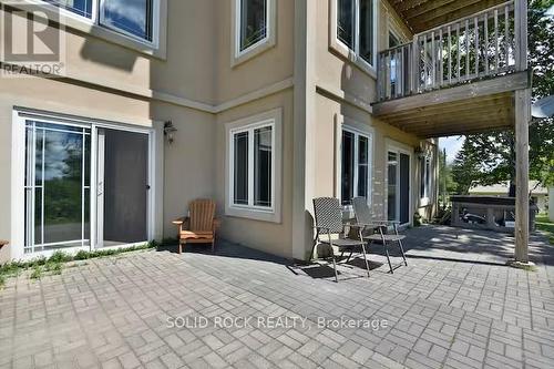 Patio door leads to bedrooms - 5 Shoreline Road, Edwardsburgh/Cardinal, ON - Outdoor With Deck Patio Veranda With Exterior
