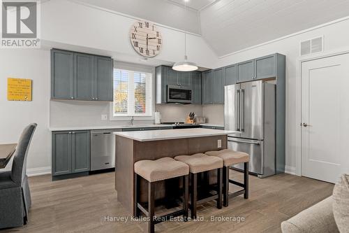 Spacious kitchen with large island - 15 - 2054 Peninsula Road, Muskoka Lakes (Medora), ON - Indoor Photo Showing Kitchen With Upgraded Kitchen