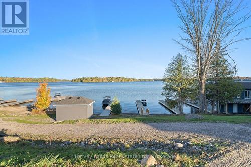 Shared waterfront with docks and beach - 15 - 2054 Peninsula Road, Muskoka Lakes (Medora), ON - Outdoor With Body Of Water With View