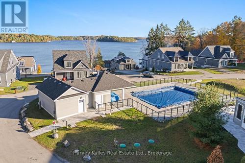 Shared pool and pool house - 15 - 2054 Peninsula Road, Muskoka Lakes (Medora), ON - Outdoor With Body Of Water