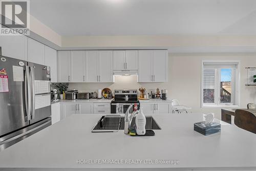 76 Oakmont Drive, Loyalist, ON - Indoor Photo Showing Kitchen With Double Sink
