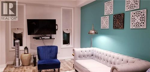 Living area featuring wood finished floors and baseboards - 118 Steeplechase Way, Waterloo, ON - Indoor
