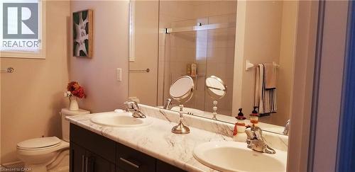 Bathroom with double vanity and a stall shower - 118 Steeplechase Way, Waterloo, ON - Indoor Photo Showing Bathroom