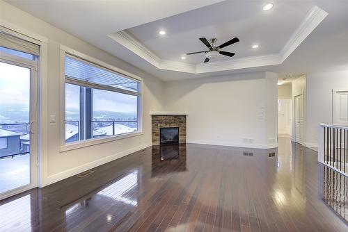 9829 Crimson Road, Lake Country, BC - Indoor Photo Showing Other Room With Fireplace