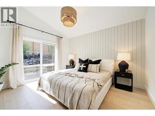 Main floor Primary suite - Staged photos are of 759 Barnaby Rd - 761 Barnaby Road, Kelowna, BC - Indoor Photo Showing Bedroom