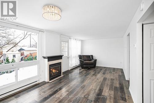 9A - 25 Britten Close, Hamilton, ON - Indoor Photo Showing Living Room With Fireplace