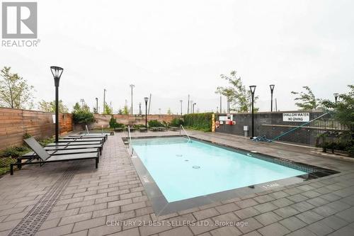 218 - 1050 Main Street E, Milton, ON - Outdoor With In Ground Pool