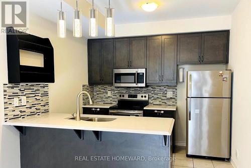 11 - 45 Heron Park Place, Toronto, ON - Indoor Photo Showing Kitchen With Double Sink With Upgraded Kitchen