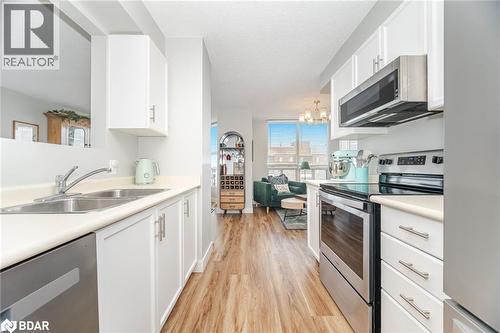 100 Millside Drive Unit# 1003, Milton, ON - Indoor Photo Showing Kitchen With Double Sink