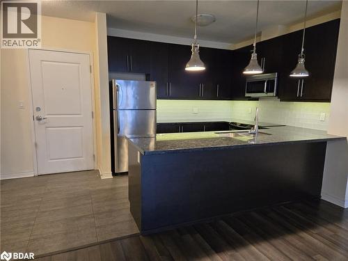 33 Whitmer Street Unit# 324, Milton, ON - Indoor Photo Showing Kitchen With Double Sink