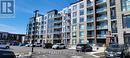 306 - 600 North Service Road, Hamilton, ON  - Outdoor With Balcony With Facade 