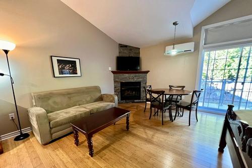 Loft - 206-500 Ch. Des Frênes, Piedmont, QC - Indoor Photo Showing Living Room With Fireplace