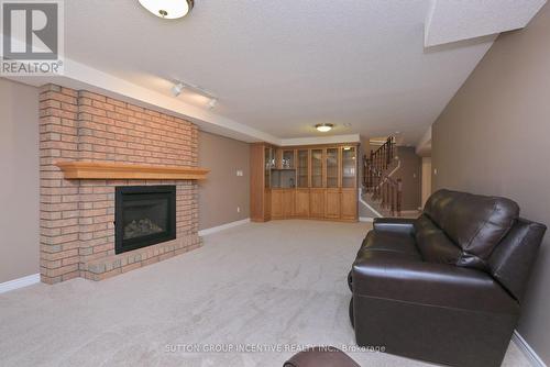 22 - 4 Belair Place, New Tecumseth, ON - Indoor Photo Showing Living Room With Fireplace