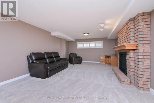 22 - 4 Belair Place, New Tecumseth, ON - Indoor Photo Showing Basement With Fireplace