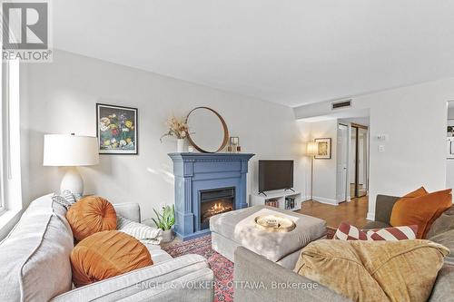 101 - 800 Mckellar Avenue, Ottawa, ON - Indoor Photo Showing Living Room With Fireplace