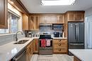 302-2130 Vasile Road, Kelowna, BC  - Indoor Photo Showing Kitchen With Double Sink 