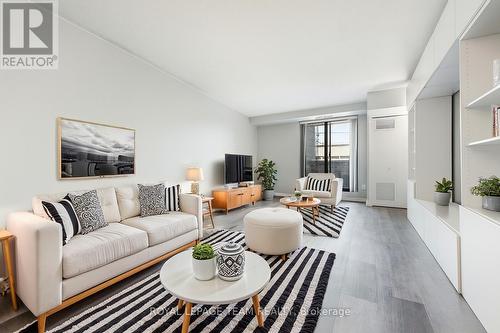 Enhanced virtually leaving shelving as is - 901 - 200 Bay Street, Ottawa, ON - Indoor Photo Showing Living Room