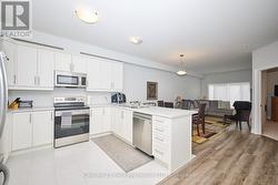 Bright open kitchen with pot lights - 