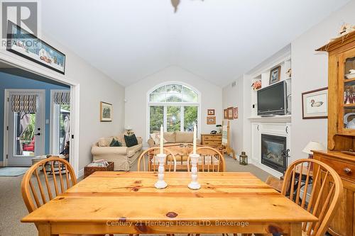 Dining area comb. with living room - 32 Sunrise Court, Fort Erie (Ridgeway), ON - Indoor Photo Showing Dining Room With Fireplace