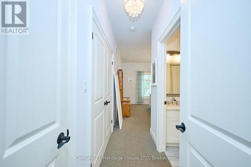 View of ensuite and primary bedroom - 32 Sunrise Court, Fort Erie (Ridgeway), ON - Indoor Photo Showing Other Room