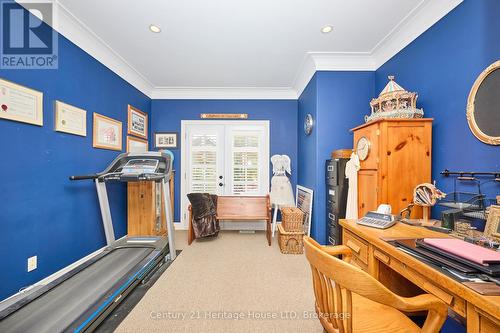 2nd bedroom/office with pot lights & glass doors - 32 Sunrise Court, Fort Erie (Ridgeway), ON - Indoor Photo Showing Gym Room