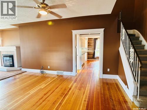 520 1St Street, North Portal, SK - Indoor Photo Showing Other Room With Fireplace