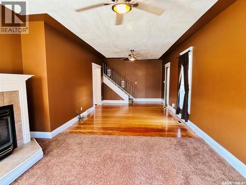 520 1St Street, North Portal, SK - Indoor Photo Showing Other Room With Fireplace