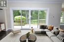 Virtual Staged Patio Doors Lots of Light - 318760 Grey Road 1, Georgian Bluffs, ON  - Indoor Photo Showing Living Room 