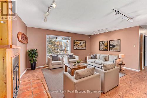 Virtually Staged - 209548 Highway 26, Blue Mountains, ON - Indoor Photo Showing Living Room With Fireplace